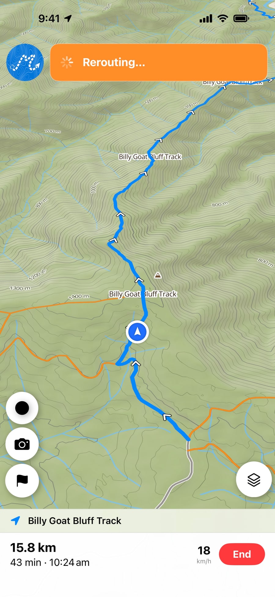 Dirt Map rerouting after a wrong turn: an orange Rerouting banner over the map, with the distance and arrival time along the bottom.